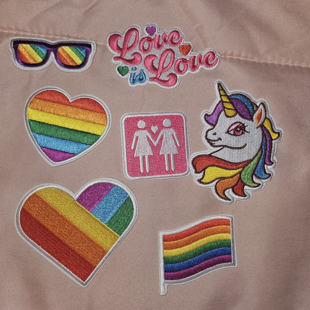 Rainbow Pride Patches on Pink Fabric